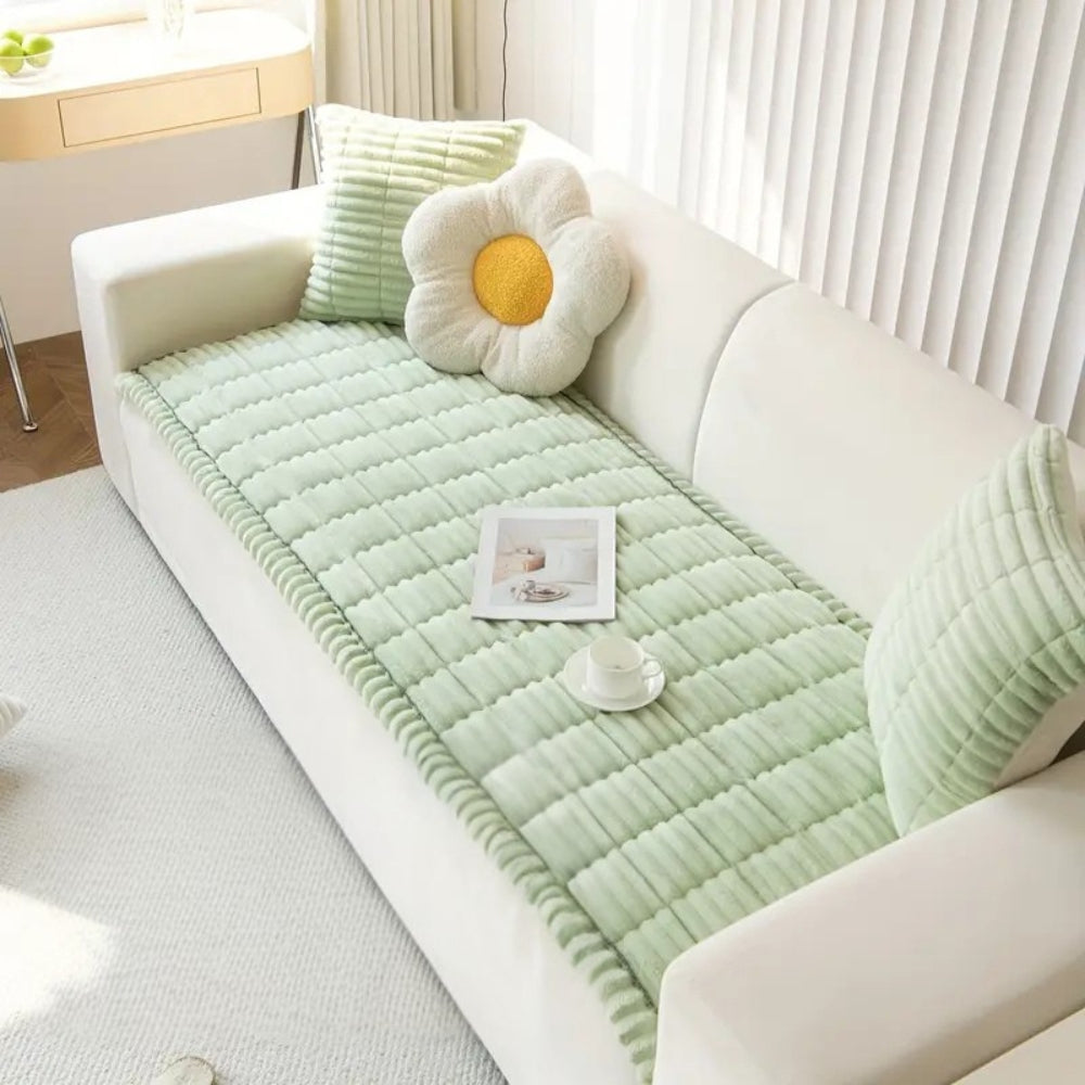 Luxuriously soft fleece textured sofa protector, quilted design, adds comfort & style.