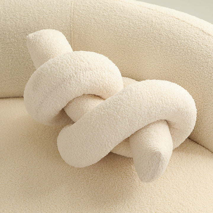Decorative plush cactus for living rooms, a soft accent pillow providing comfort.