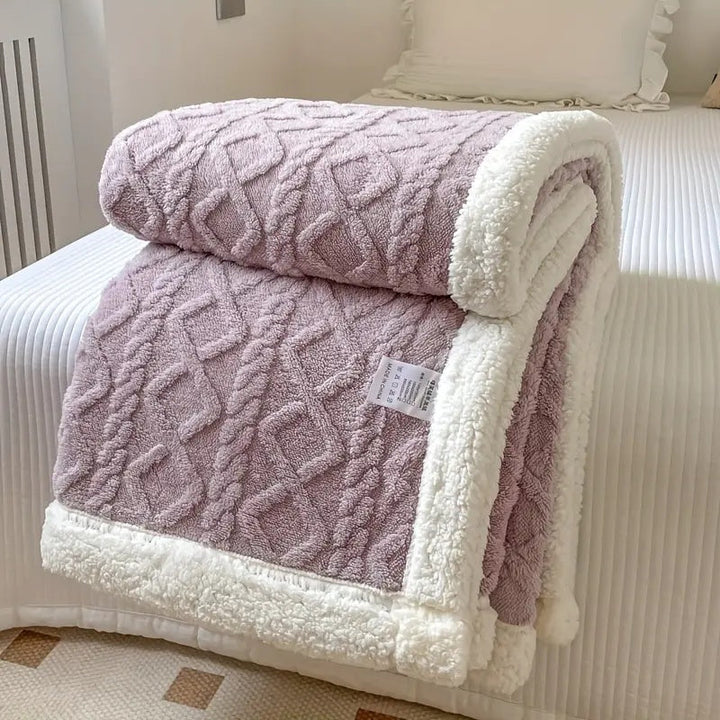 Reversible Sherpa throw blanket, plush and cozy, perfect for year-round comfort in any home decor.