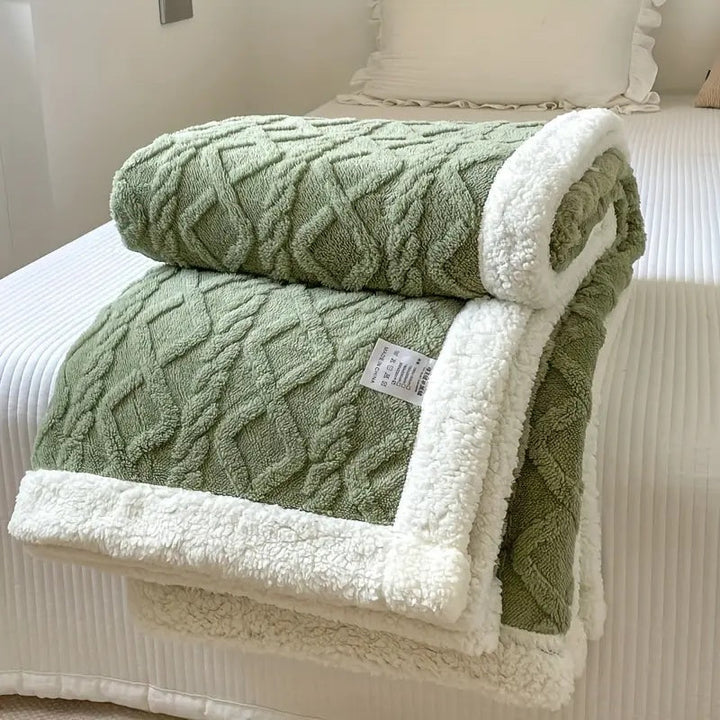 Soft plush Sherpa throw blanket, cozy texture for luxurious comfort & home decor.