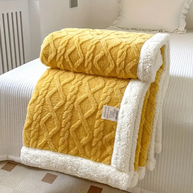 Stylish plush Sherpa throw blanket adds warmth and a cozy accent to living rooms or bedrooms.
