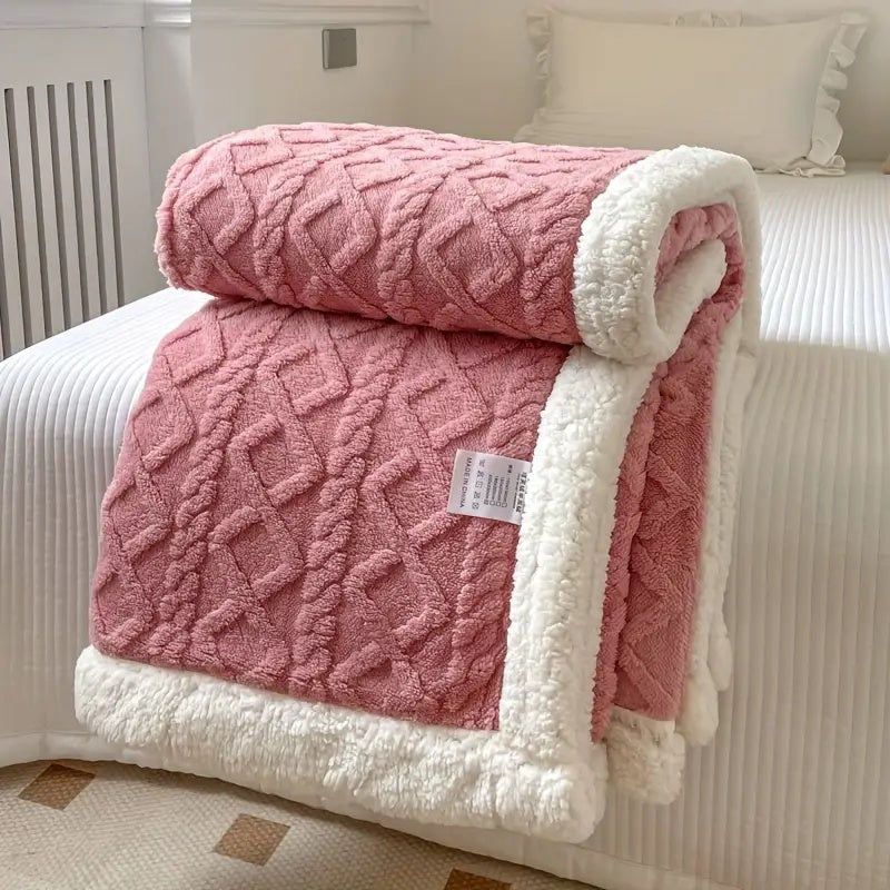 Ultra-soft Sherpa throw blanket, reversible design offers plush comfort for all seasons.