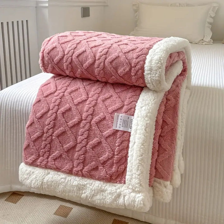 Ultra-soft Sherpa throw blanket, reversible design offers plush comfort for all seasons.