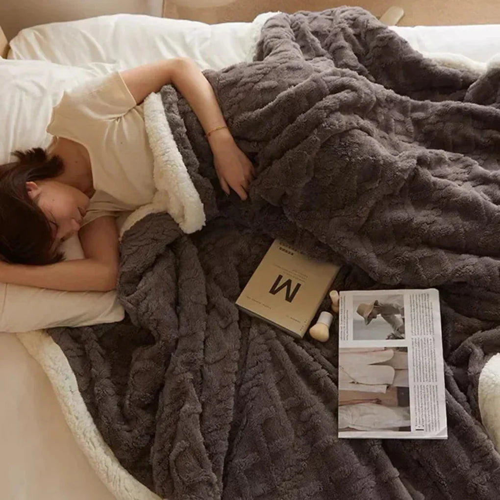 Stay warm all winter with this super soft, thick, and plush polyester throw blanket.