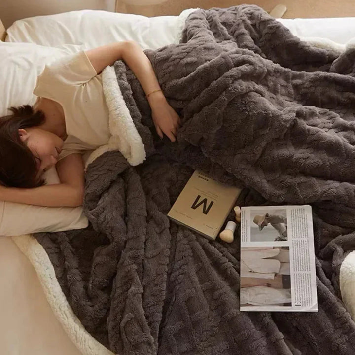 Stay warm all winter with this super soft, thick, and plush polyester throw blanket.
