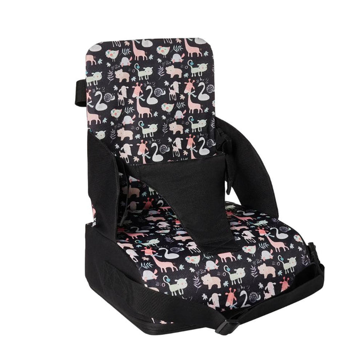 Portable baby booster seat attaches securely to dining table for easy feeding.