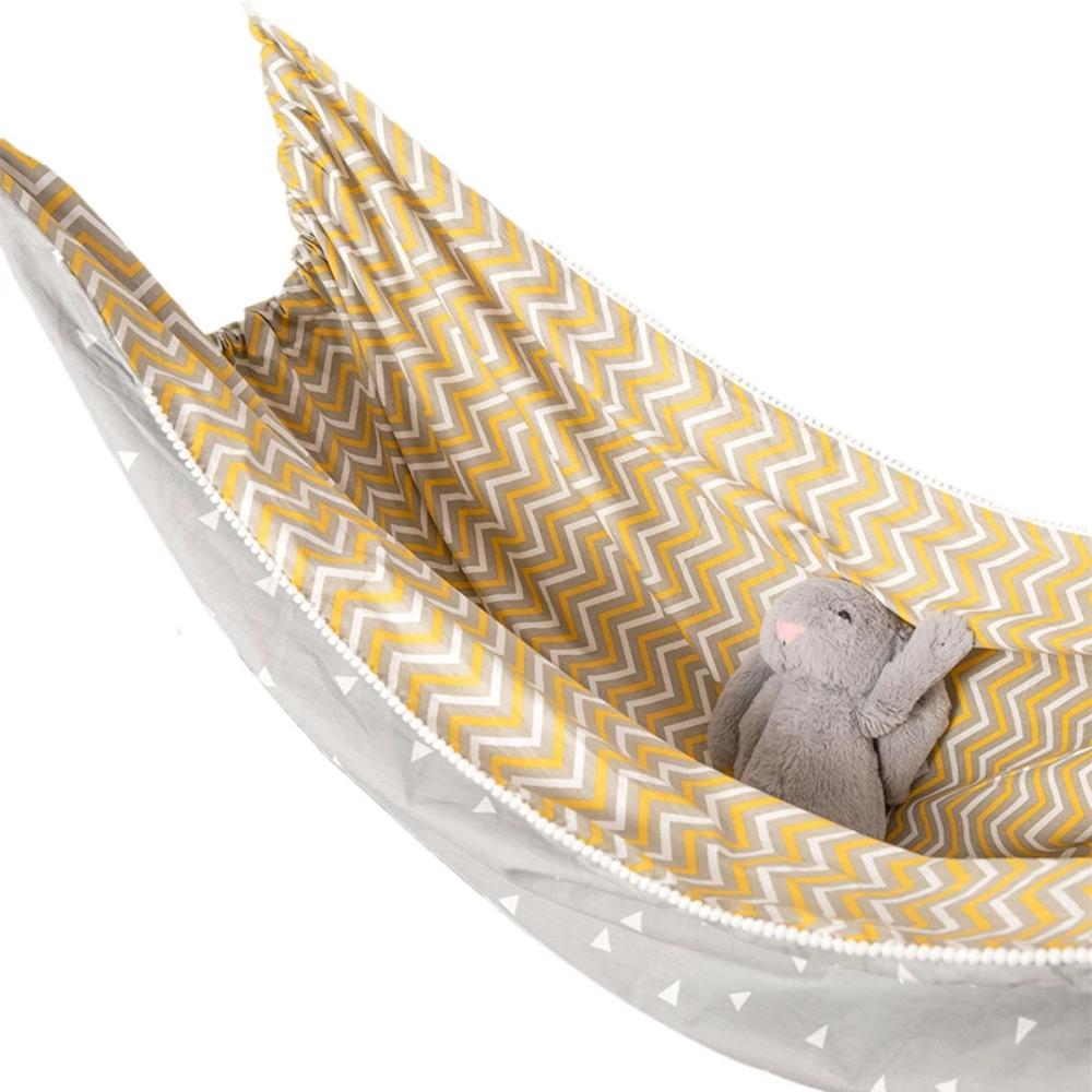 Portable baby hammock for indoor use, providing a calming and developmental play space for infants.