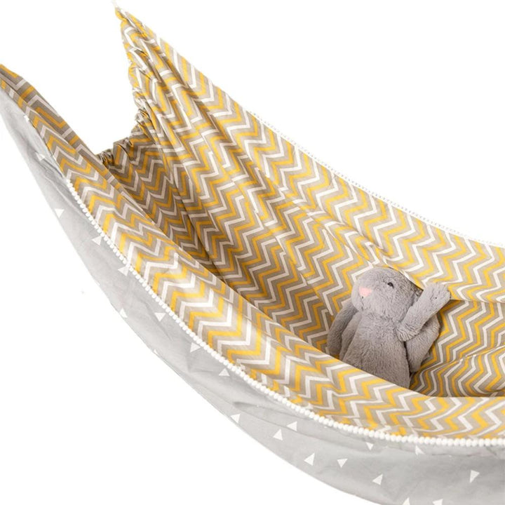 Portable baby hammock for indoor use, providing a calming and developmental play space for infants.