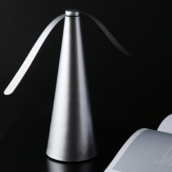 Portable fly repellent fan for outdoor patio dining. Battery operated insect control for peaceful summer meals.