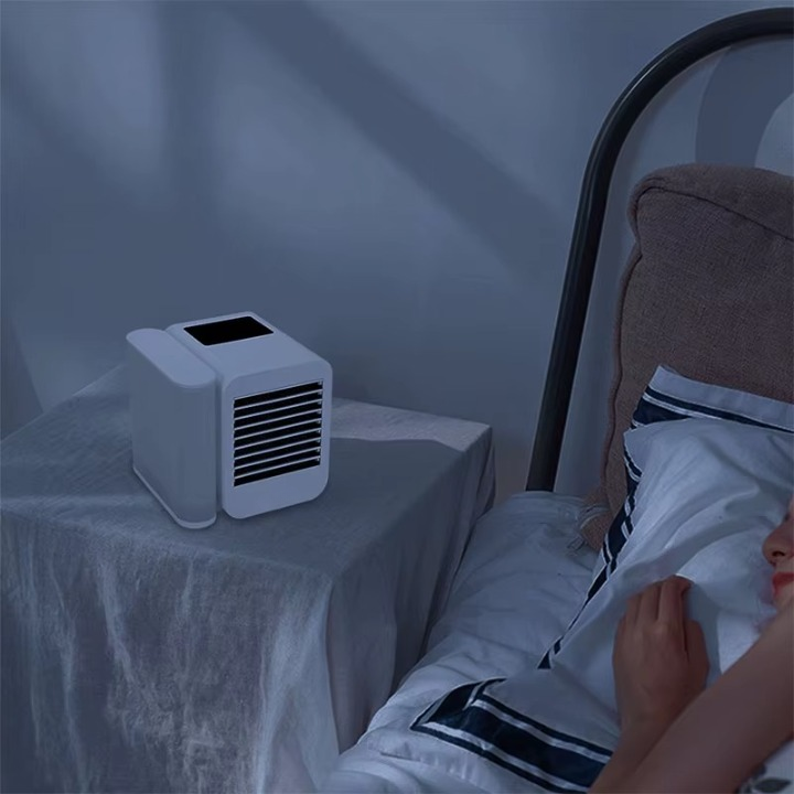 Evaporative mini air cooler with visible water tank, providing cool, humidified air for comfort.