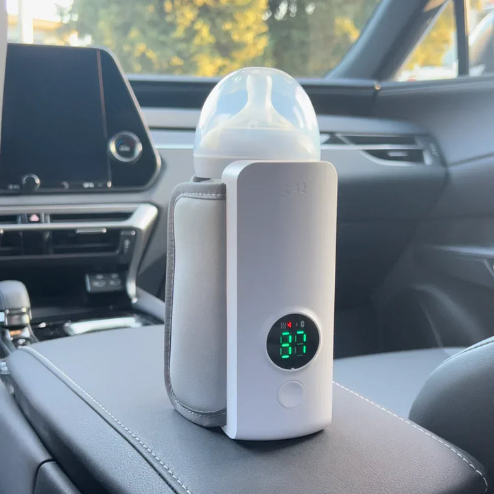 Parent essential: portable, rechargeable baby bottle warmer with digital display for easy feeding anywhere.