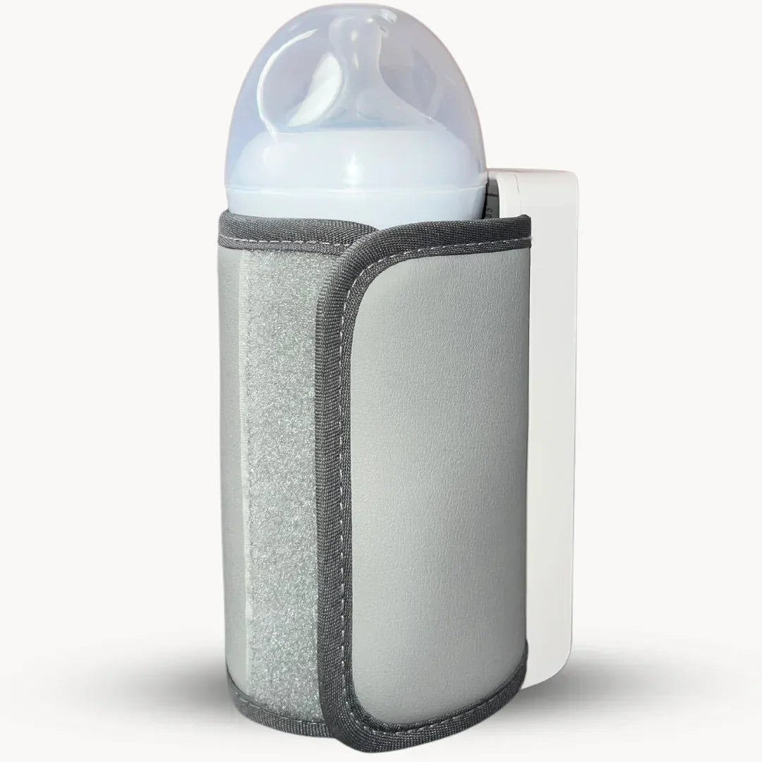 Sleek portable baby bottle warmer, rechargeable, showing digital temp display for infant milk.