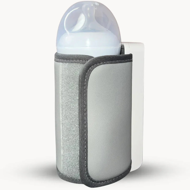 Sleek portable baby bottle warmer, rechargeable, showing digital temp display for infant milk.