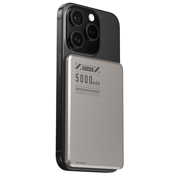 Portable magnetic power bank, sleek design & wireless charging capability.