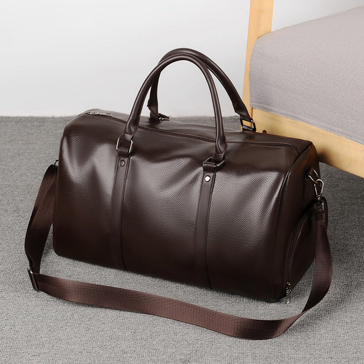 Premium brown leather men's weekend duffle bag, perfect for stylish travel & carry-on luggage.