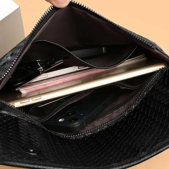 Slim profile men's compact leather crossbody bag. Discreet & stylish for any outfit.