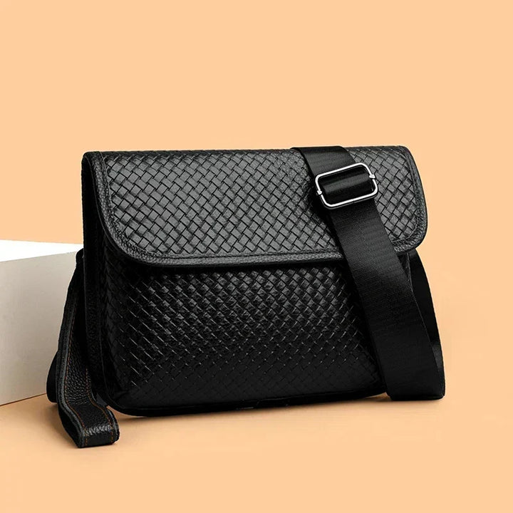 Interior pockets of men's genuine leather sling bag. Organized storage for everyday items.