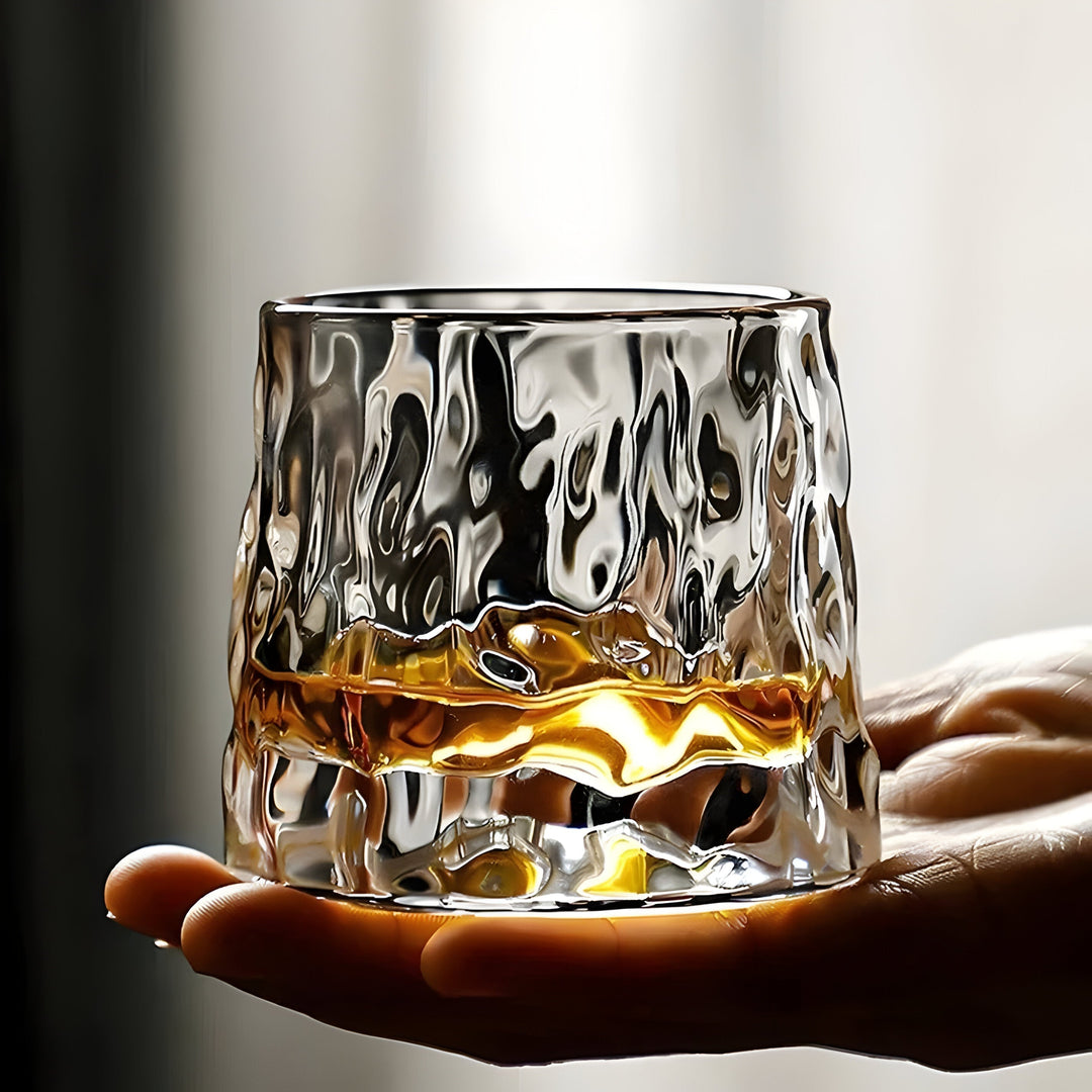 Modern rotating crystal tasting glass with unique textured pattern. Ideal whiskey glass for home bar & spirits connoisseurs.
