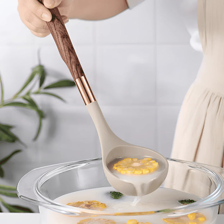 Premium kitchenware set: non-stick silicone utensils with ergonomic wood handles. Essential cooking tools.