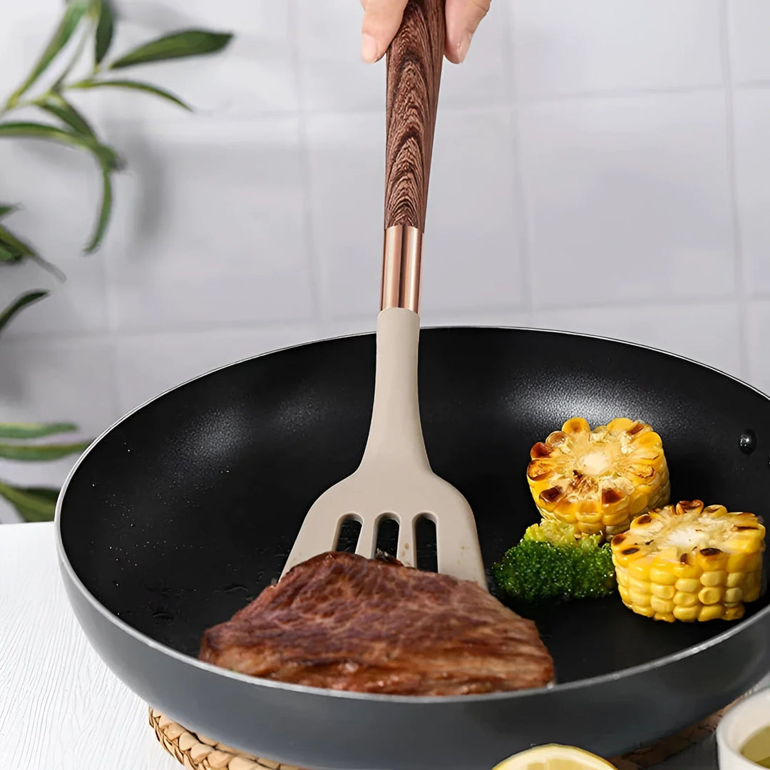Durable, non-stick silicone kitchen utensil set with elegant wood handles. Heat-resistant cooking tools for home use.