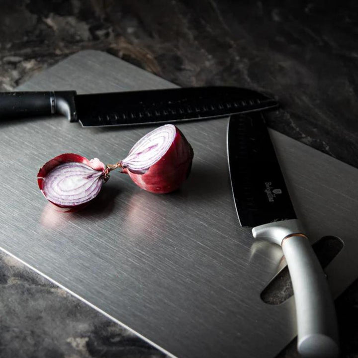 Robust stainless steel cutting board for professional kitchen hygiene. Non-slip design, easy-to-clean surface.