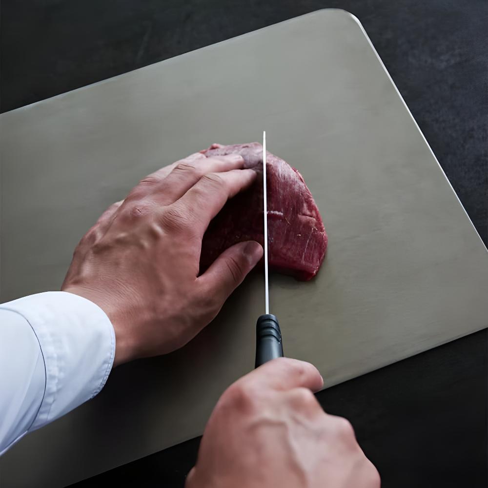 Dishwasher-safe stainless steel cutting board. Durable, hygienic, and non-slip for efficient kitchen food prep.