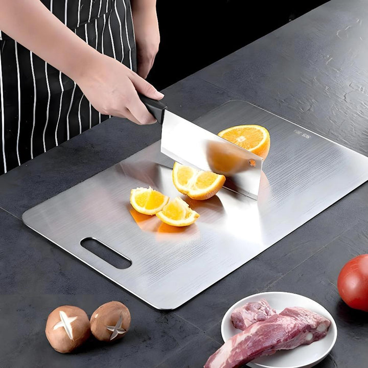 High-quality stainless steel cutting board, silver finish. Durable for kitchen use, promotes hygiene & food safety.