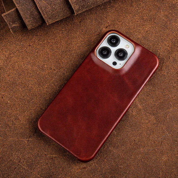 Leather iPhone case mounted on phone, highlighting slim profile, shock absorption, & secure grip.