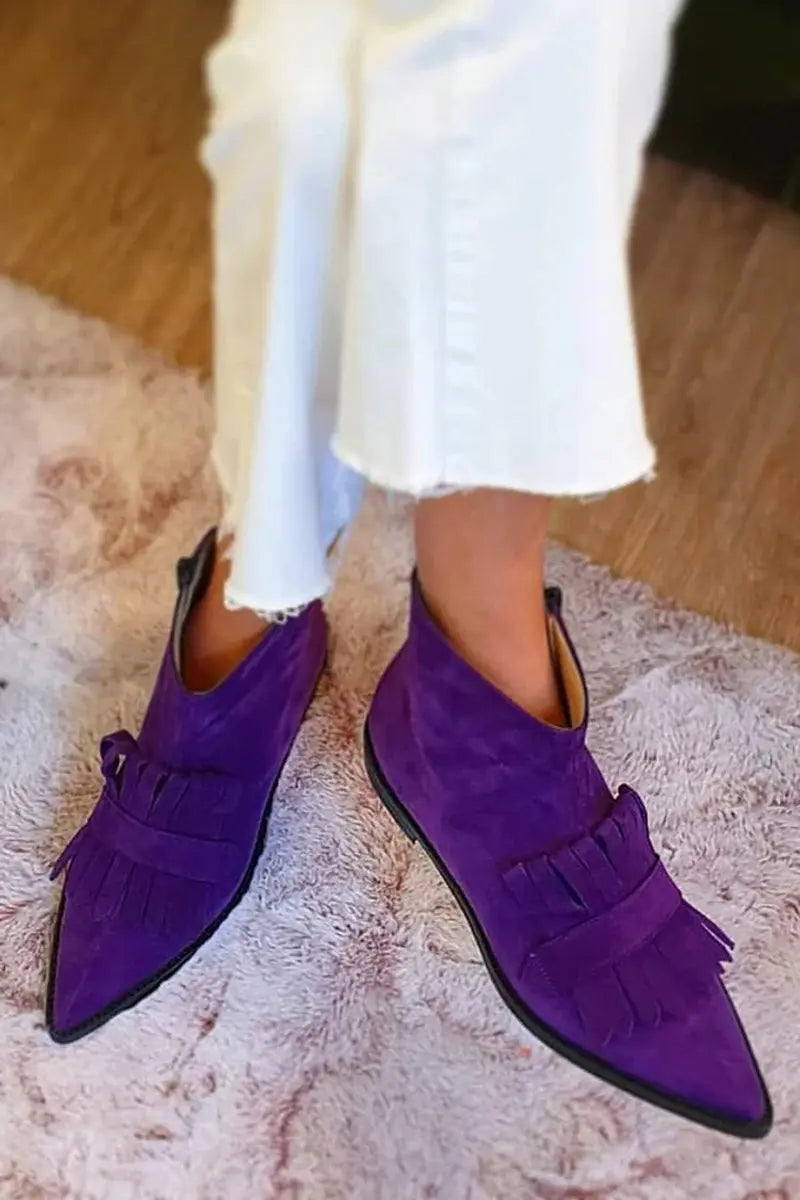 Purple women's flat ankle boots with stylish fringe and a sharp pointed toe for bold, everyday casual comfort.