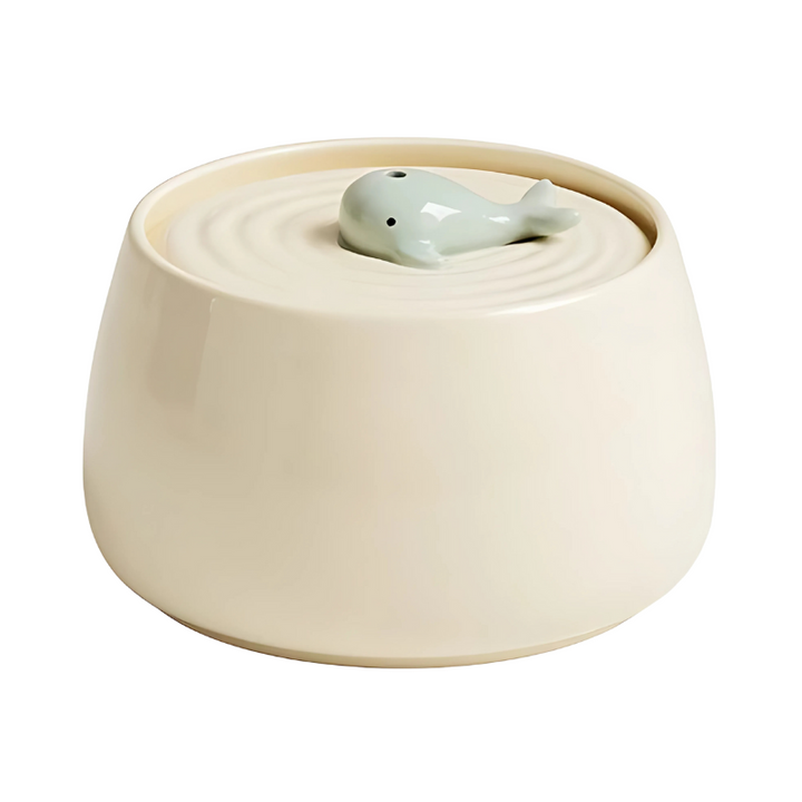 Green ceramic pet fountain, quiet operation, provides continuous fresh filtered water for pets.