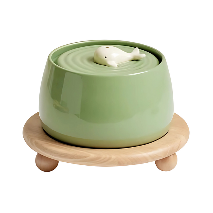 Beige ceramic pet water fountain, 2L capacity, quiet pump, triple filtration for clean water.