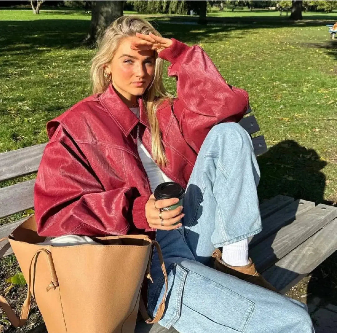 Effortless red oversized quilted bomber jacket for women, a stylish zip-up outerwear piece.