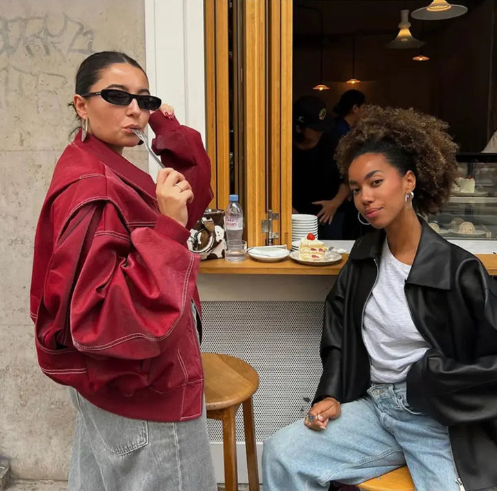 Trendy red women's oversized quilted bomber jacket, offering comfort and style for winter.