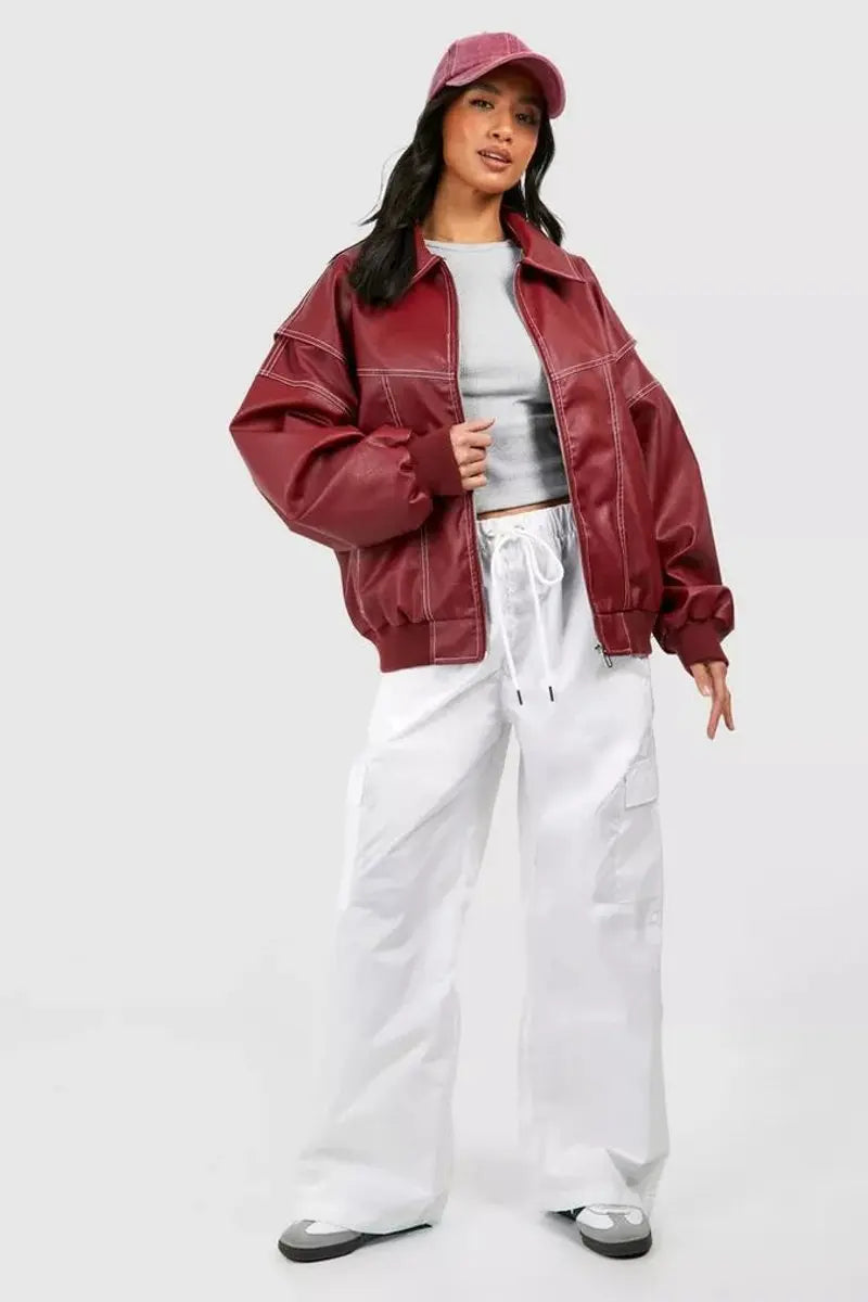 Warm red oversized quilted bomber jacket, essential women's outerwear for autumn and winter.