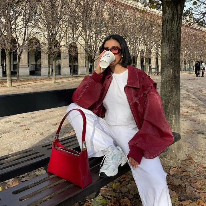 Women's versatile red oversized quilted bomber, a chic and casual layering jacket.
