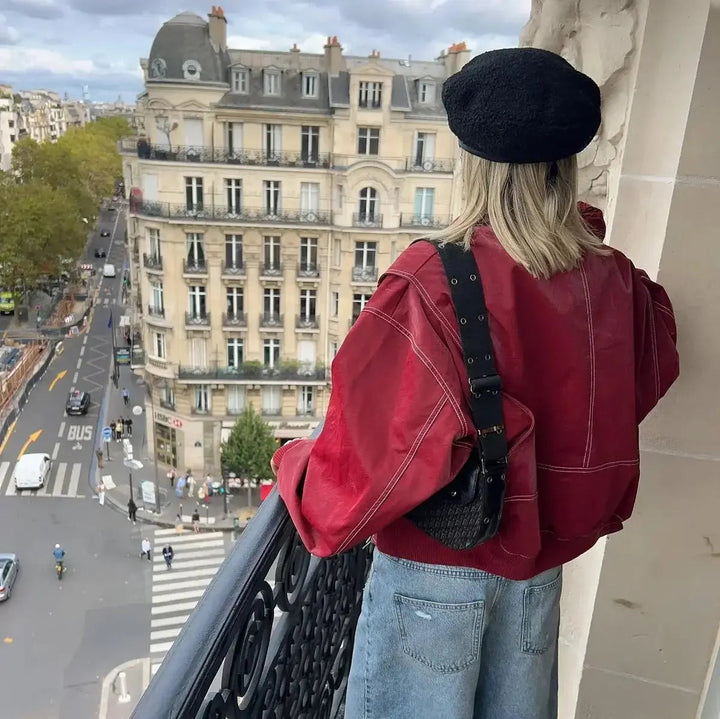 Fashionable red oversized quilted bomber jacket, a stylish statement piece for women.