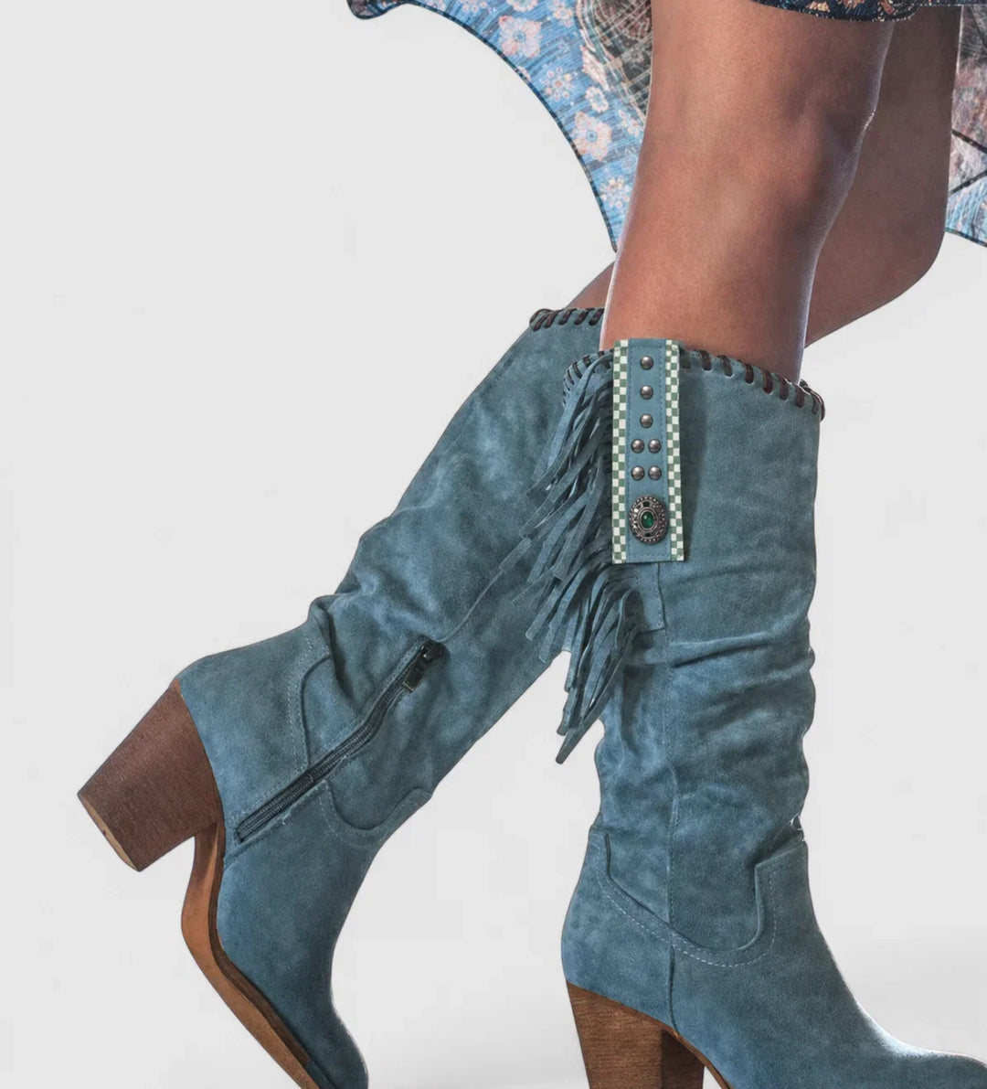 Stylish blue women's knee-high western boots with fashionable fringe & a sturdy block heel. Orthopedic comfort.