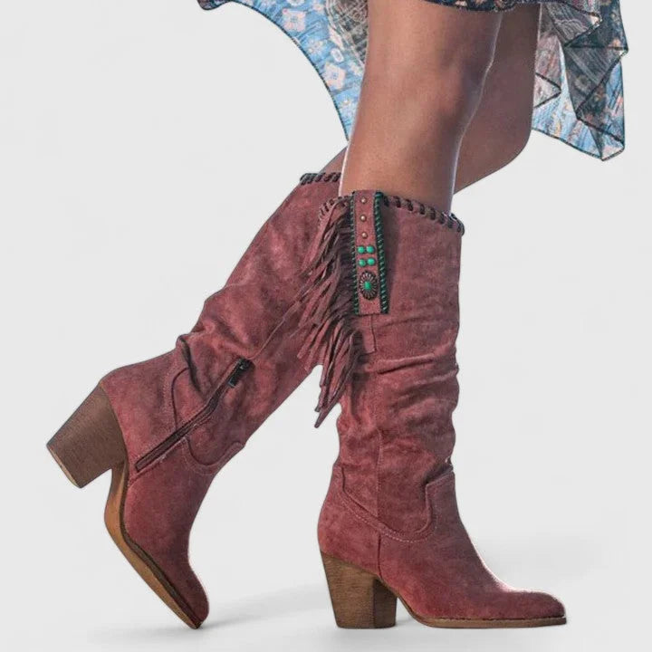 Trendy pink women's orthopedic knee-high western boots. Features stylish fringe, a comfortable block heel & support.