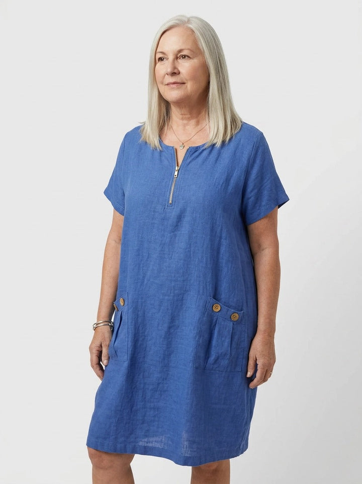 Blue zip-front summer dress with V-neck. Effortless relaxed fit, knee-length for women's casual daywear.