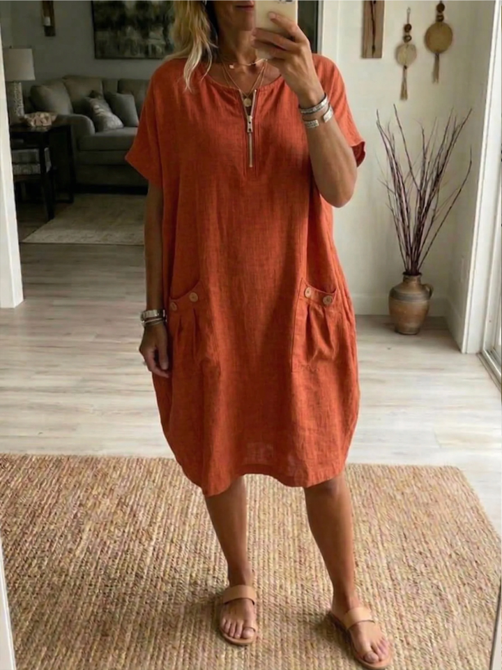 Knee-length zip-front summer dress for women. Relaxed fit V-neck design, great casual day or holiday wear.