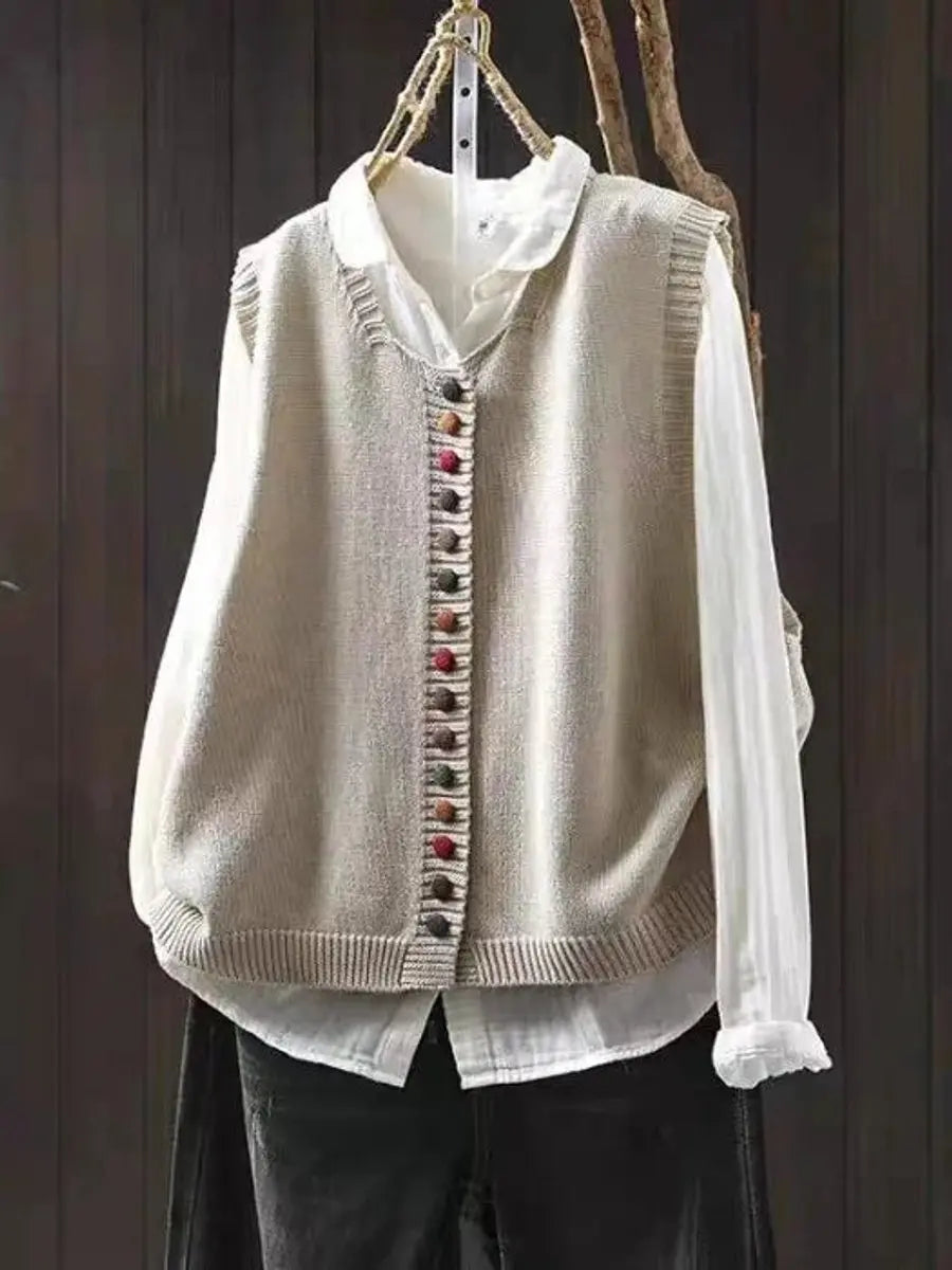 Relaxed fit women's knitted vest with button-up front, perfect for casual autumn layering and everyday style.
