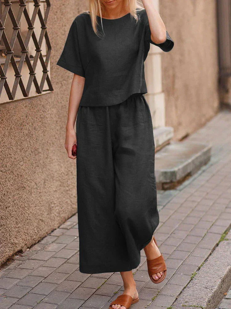 Stylish women's linen two-piece outfit featuring a relaxed top and wide-leg pants for casual summer wear.