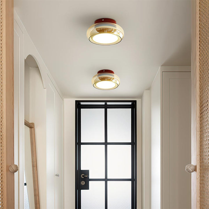 Modern retro flush mount ceiling light, providing warm LED ambient lighting.