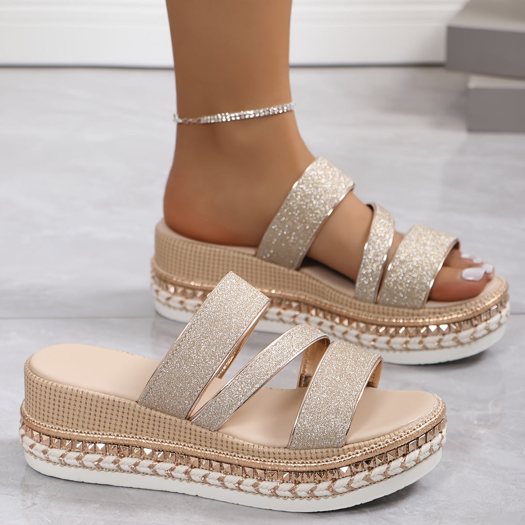 Fashionable rose gold multi-strap platform sandals for women, offering elevated style and comfort.