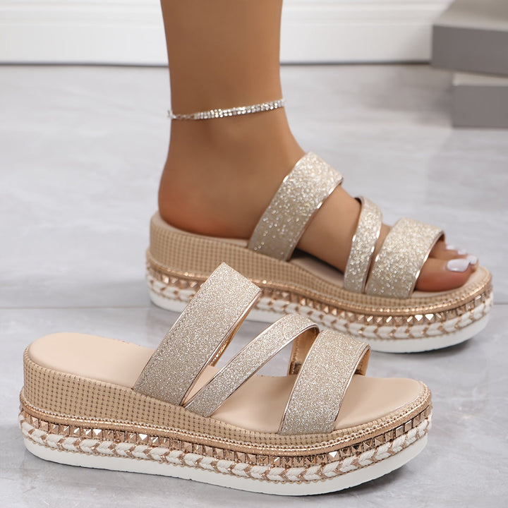 Fashionable rose gold multi-strap platform sandals for women, offering elevated style and comfort.