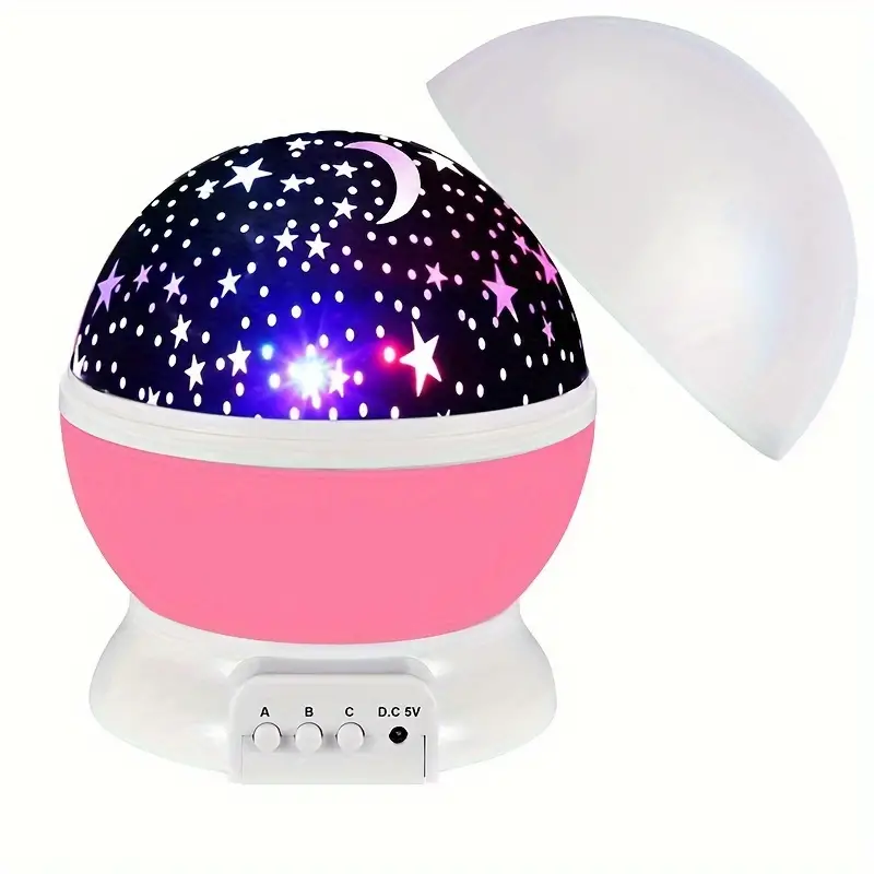 Rotating star projector night light casting stars on a child's bedroom ceiling. Soothing LED ambiance.