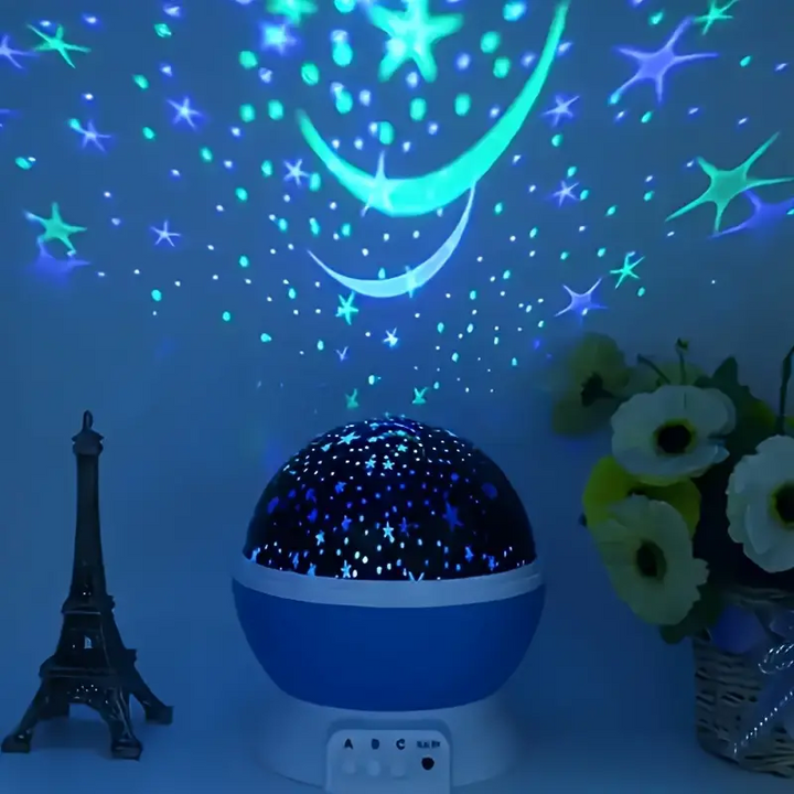 Close-up of a rotating star projector night light, showing its LED light glowing with celestial patterns.