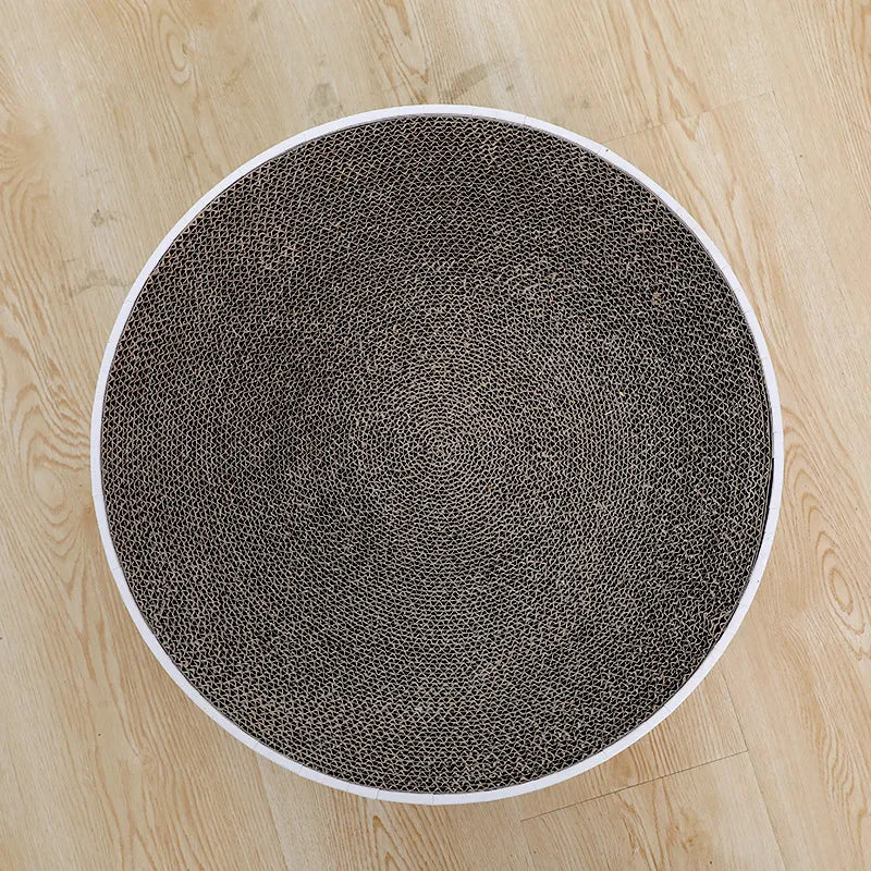 Cat's round scratching mat provides fun, relaxation, and healthy claw maintenance. Essential pet care item.