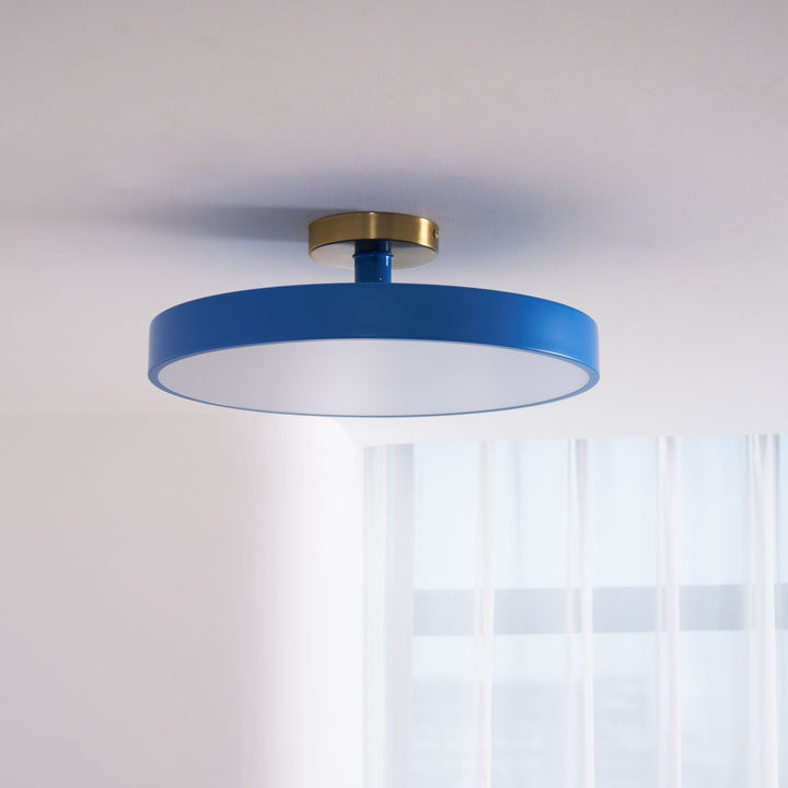 Sleek round LED ceiling light, flush mount for a minimalist modern home.