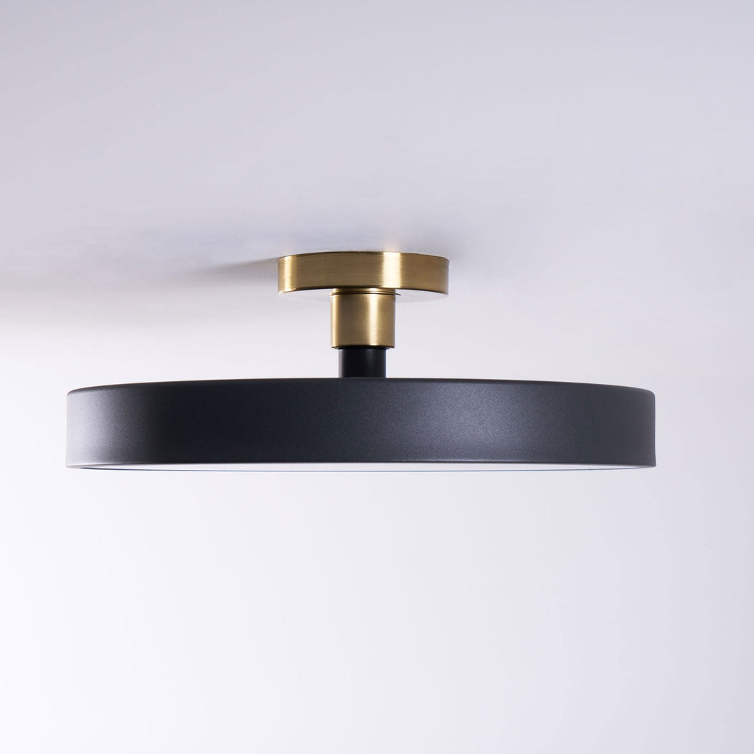 Sleek round LED flush mount, modern ceiling fixture for subtle lighting.